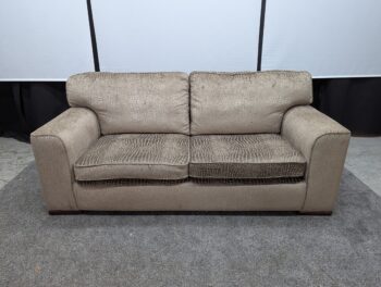 Elegant beige reptile-embossed fabric 3-seater sofa with plush cushions and wide armrests. Perfect for contemporary living rooms, showcasing luxurious style and comfort in excellent condition.