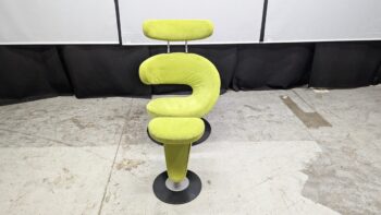 Stylish green fabric recliner chair with a distinctive shape and adjustable headrest, ideal for contemporary living rooms or offices.