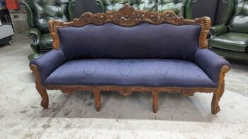 Blue antique wingback 3-seater sofa, refurbished, vintage style, elegant wooden frame.