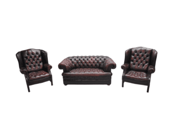 Leather armchair and sofa in dark brown, classic Chesterfield style.