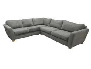 Modern grey corner sofa with plush cushions and wooden feet.