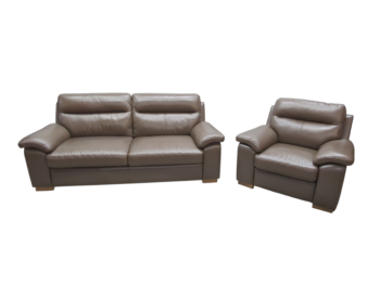 Two beige leather sofas, a 2-seater and an armchair, with plush cushions and wide armrests, perfect for a contemporary living room.