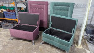 Elegant upholstered chairs in pink and teal with black accents