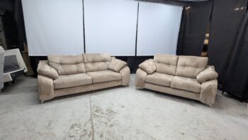 Two beige 3-seater sofas with plush cushions and wide armrests, ideal for living rooms.