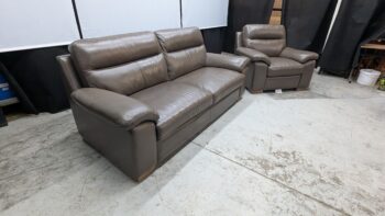 Elegant brown leather 3-seater sofa with plush cushions.
