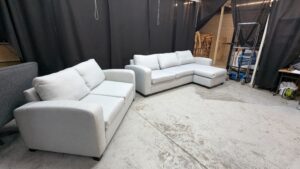 Modern L-shaped corner sofa in light grey fabric