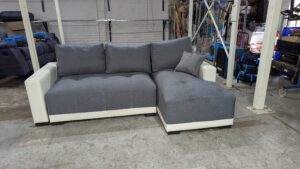 Modern grey corner sofa with white accents