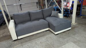 Modern grey corner sofa with white accents