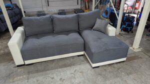Modern grey corner sofa with white accents
