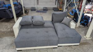 Modern grey corner sofa with white accents